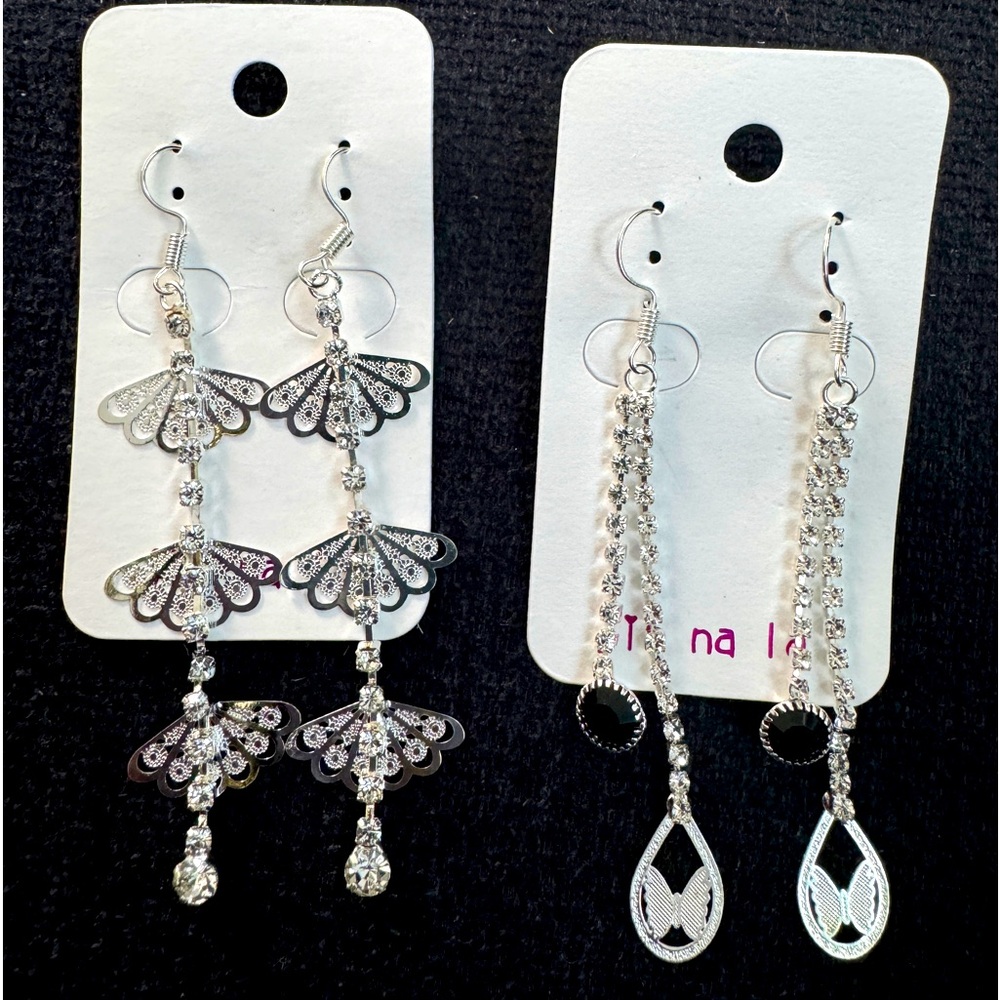 Set of two silver tone dangling earrings